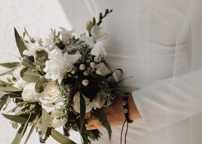 minimalistic wedding dress bride beautiful wedding bouquet made white flowers greenery classy attire scaled
